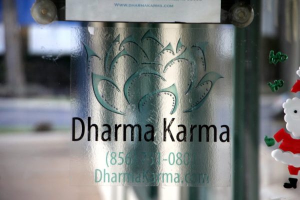 Dharma Karma Cherry Hill NJ logo sign lotus