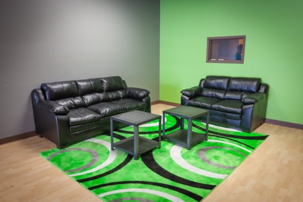 Club Vape Hebron KY green room rug black leather couches