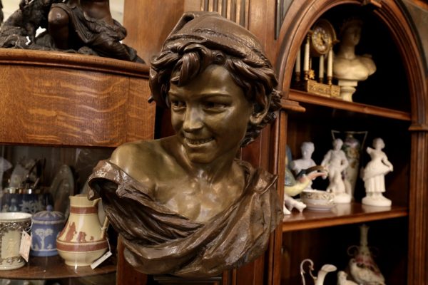 A Galerie Alexandria, VA Antique Store bronze bust of boy