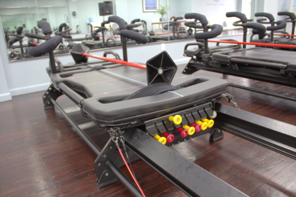 Coastal Core Fitness Pilates Studio Belmar NJ logo excercise machine