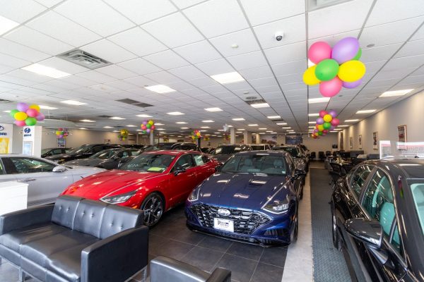 red and blue cars in Plaza Hyundai Car dealer in Brooklyn, NY