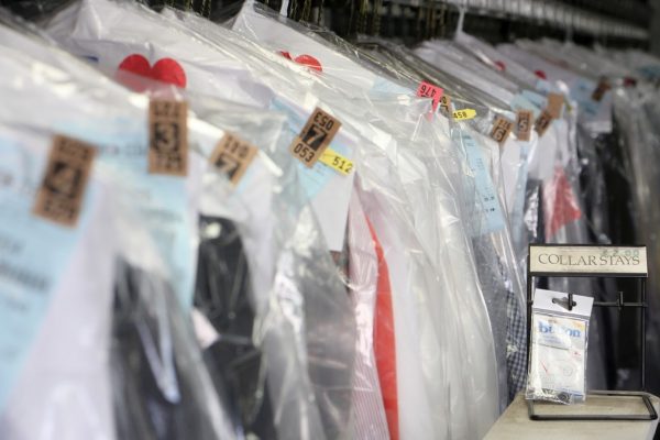 dry cleaning rack at counter at Kingston Cleaners Cherry Hill NJ.jpg