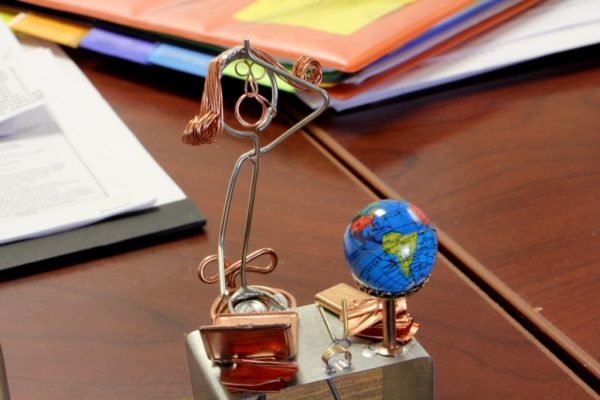 MCA Travel Inc Cherry Hill NJ wire sculpture exasperation at office desk