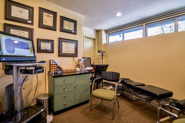 Roxbury Spine and Wellness Clinic Seattle, WA Chiropractor office license diplomas table