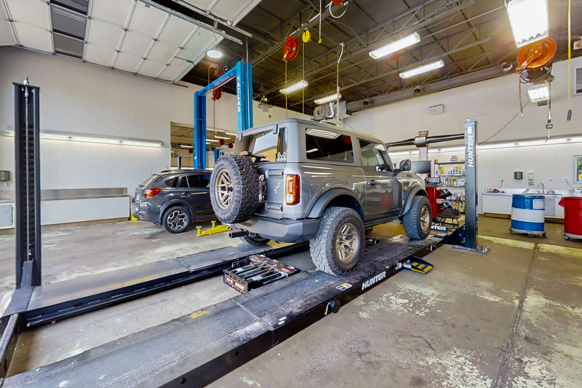 hydraulic lifts at University Auto and Tire, Fayetteville, AR 360 Virtual Tour for Auto Repair shop