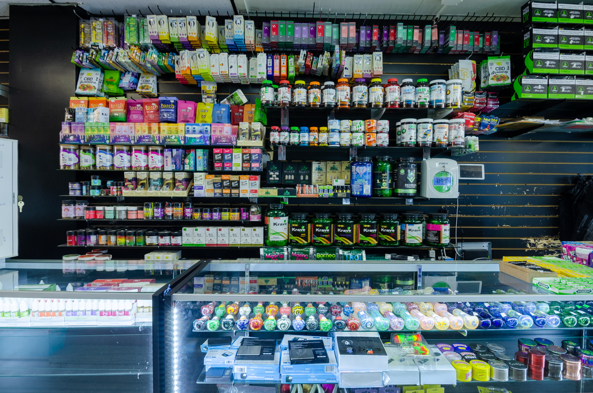 behind the counter items at Main Street Smoke And Vape, San Diego, CA 360 Virtual Tour for Tobacco shop