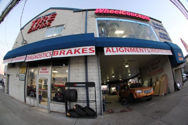 Wil Johns Tire Empire Staten Island NY tire dealer and auto repair shop store front entrance garage