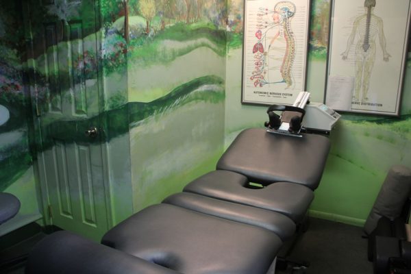 Advanced Chiropractic and Wellness Center Pennsauken Township NJ Neil Liebman Chiropractor adjusting table bench