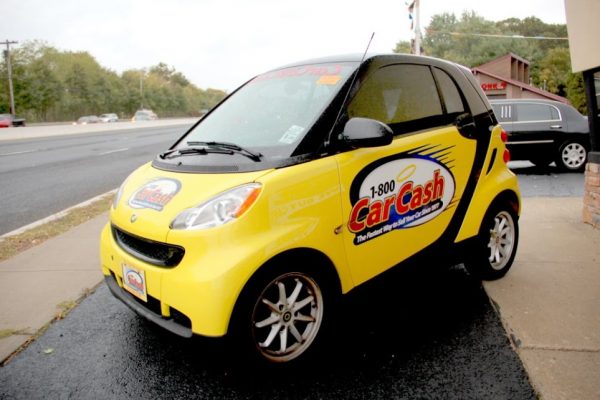 Car Cash NJ East Brunswick NJ yellow smart car logo decal sign