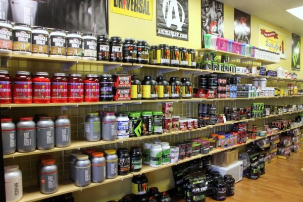 Rock Bottom Nutrition Fitness Center Cherry Hill NJ wall display muscle milk optimizer whey protein powder shakes