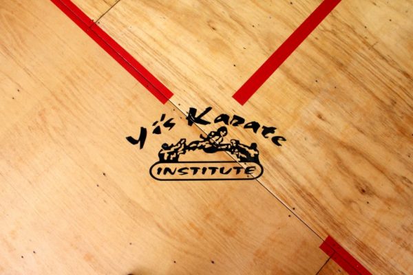 Yi's Karate of Cherry Hill NJ dojo wood floor logo