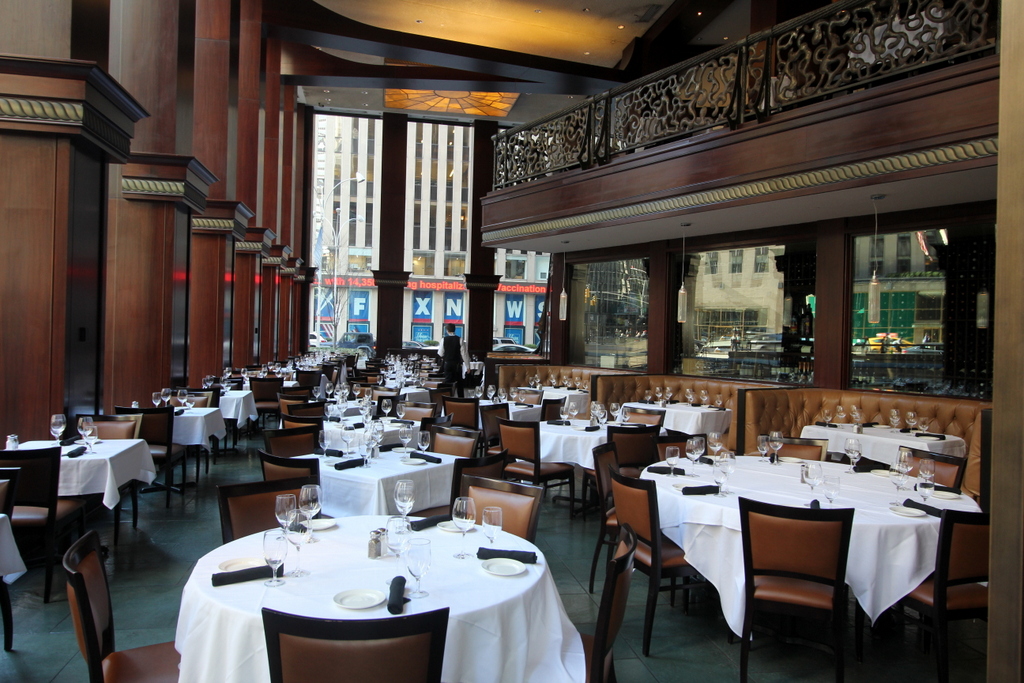Del Frisco's Double Eagle Steak House in New York City table seating in dining hall