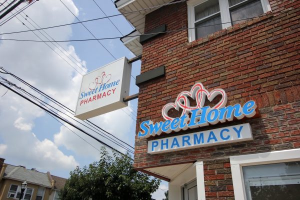Sweet Home Pharmacy in Yeadon, PA brick exterior signs